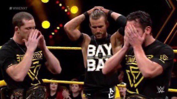 Pro wrestlers Adam Cole, Kyle O’Reilly, and Rodrick Strong all looking completely devastated 