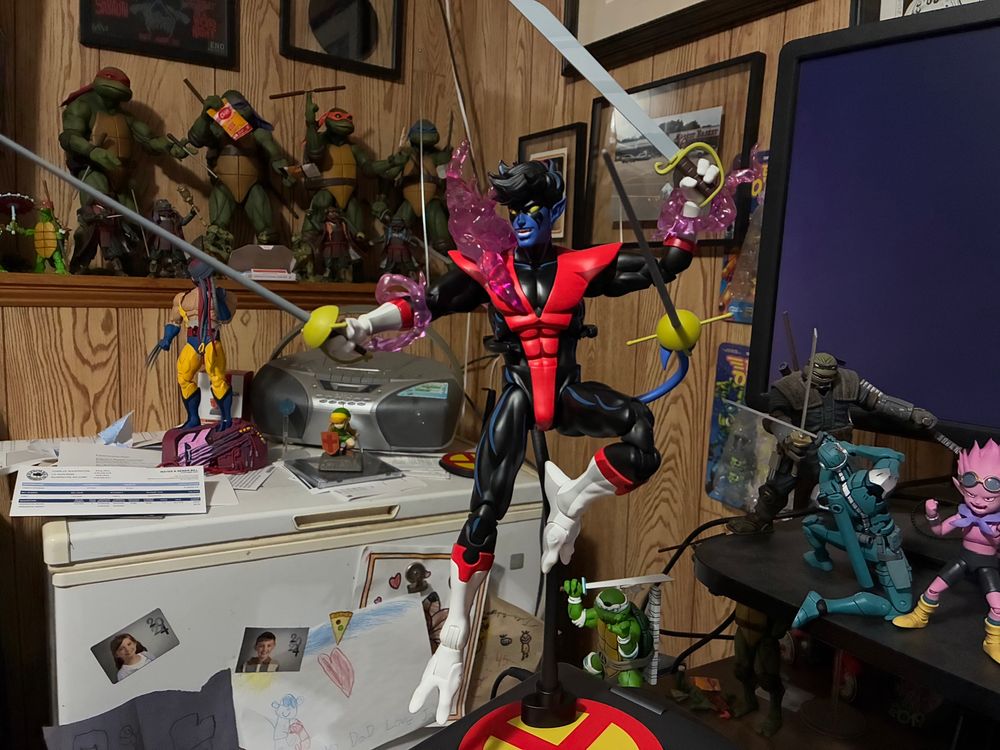 Mondo’s Nightcrawler action figure on a flight stand from their line of sixth scale X-Men’97 figures.