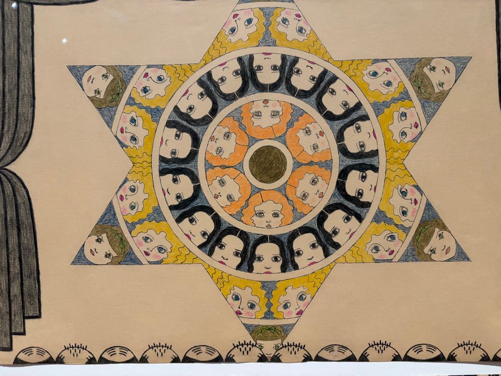 A six-pointed star filled with women’s faces.