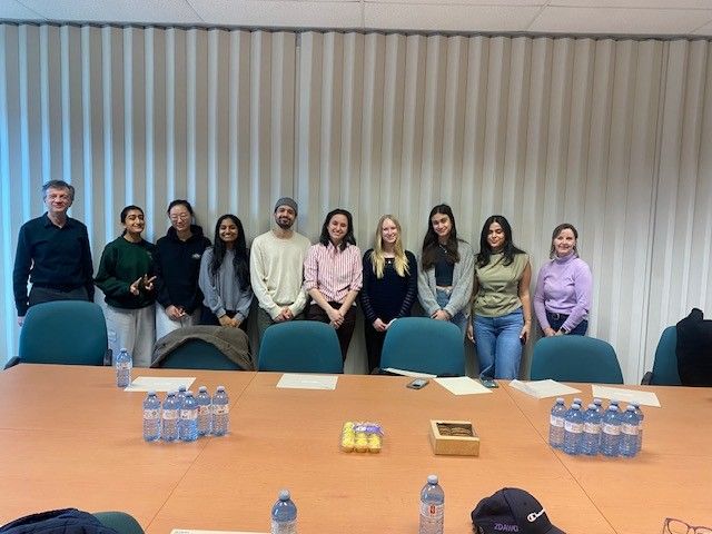Tracey and Dr Shahram stand with 8 ECE ambassadors.
