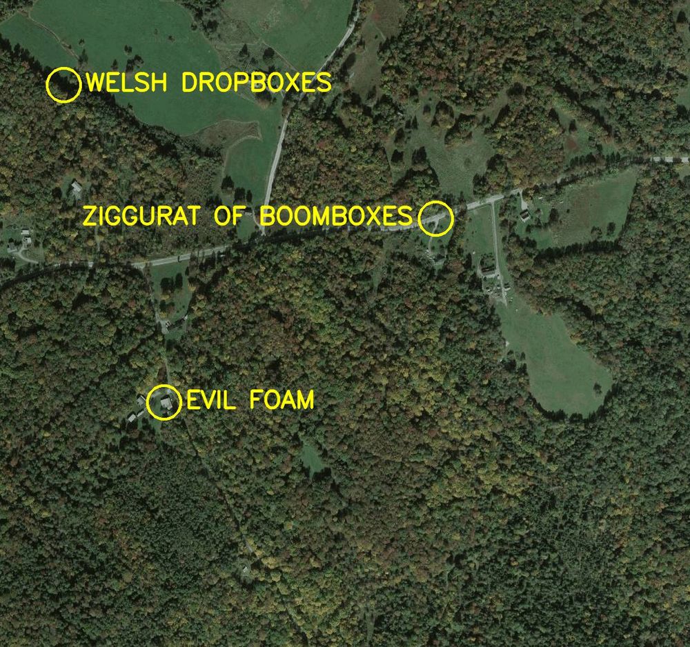 Aerial satellite photo labelled in bright yellow letters: 

1. Ziggurat of Boomboxes
2. Welsh Dropboxes
3. Evil Foam
