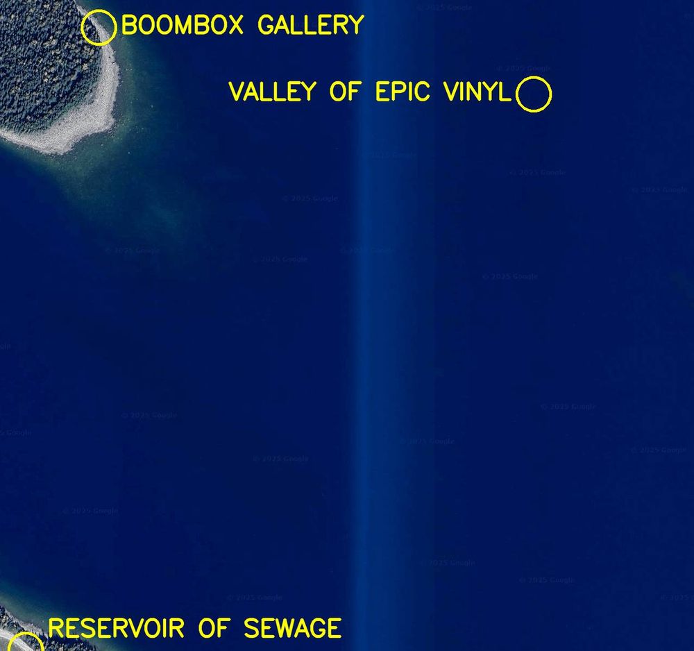 Aerial satellite photo labelled in bright yellow letters: 

1. Reservoir of Sewage
2. Valley of Epic Vinyl
3. Boombox Gallery

