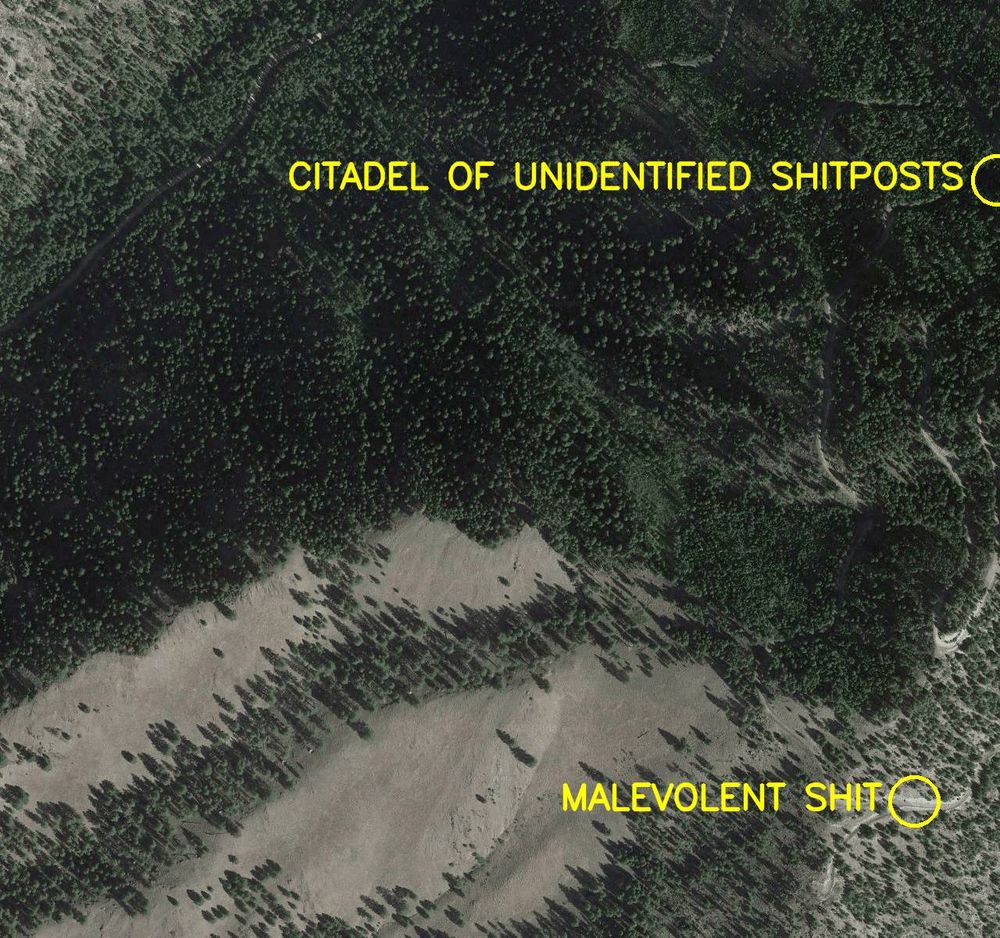 Aerial satellite photo labelled in bright yellow letters: 

1. Malevolent Shit
2. Citadel of Unidentified Shitposts