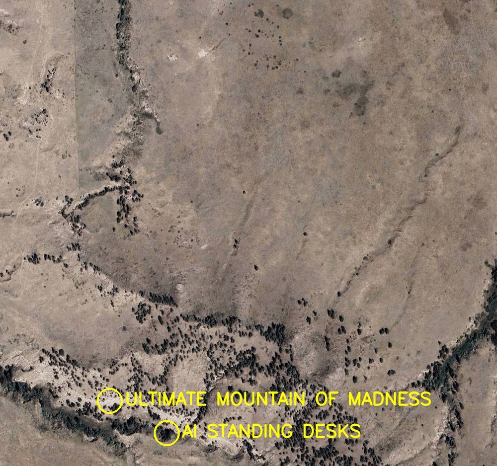 Aerial satellite photo labelled in bright yellow letters: 

1. Ultimate Mountain of Madness
2. AI Standing Desks