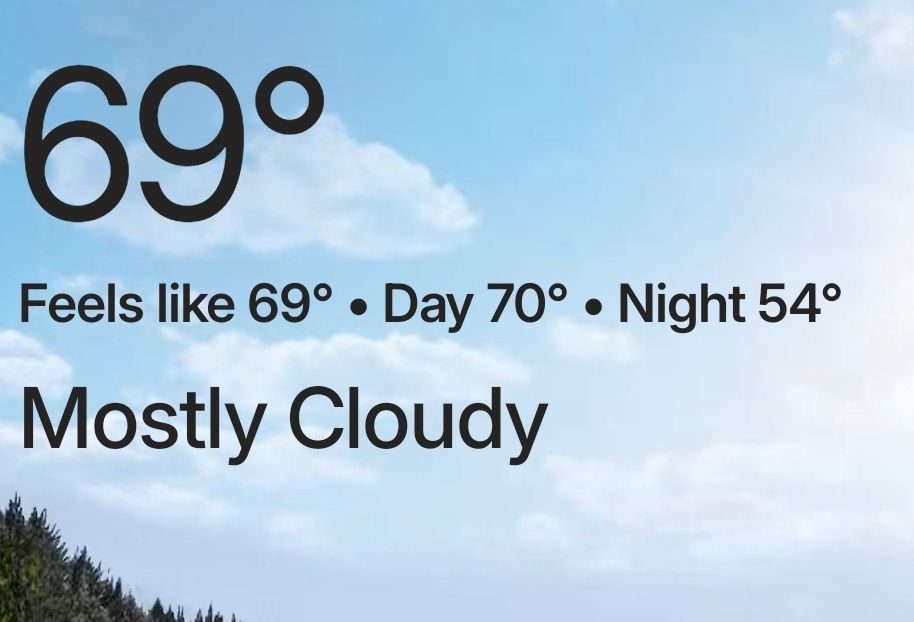 Screen shot of weather app showing a high of 69°F and a low tonight of 54°F, with mostly cloudy skies. PERFECT weather...if I hadn't spent the preceding months suffering with the AC set to 80 and, apparently,  acclimating to the warmer temps. 