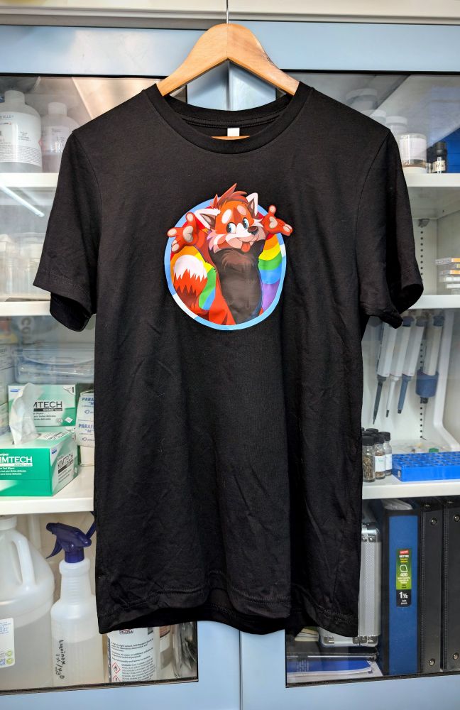 Back at the lab from Anthrocon and shirts are now up on the site! Show off that "Ringtail Rizz" with our Panda Pride tee. Sizes XS ➡️ 4XL on fancy Bella + Canvas cotton/poly blend! We're rocking this under our labcoats while whipping up your fav. treats... 🥼