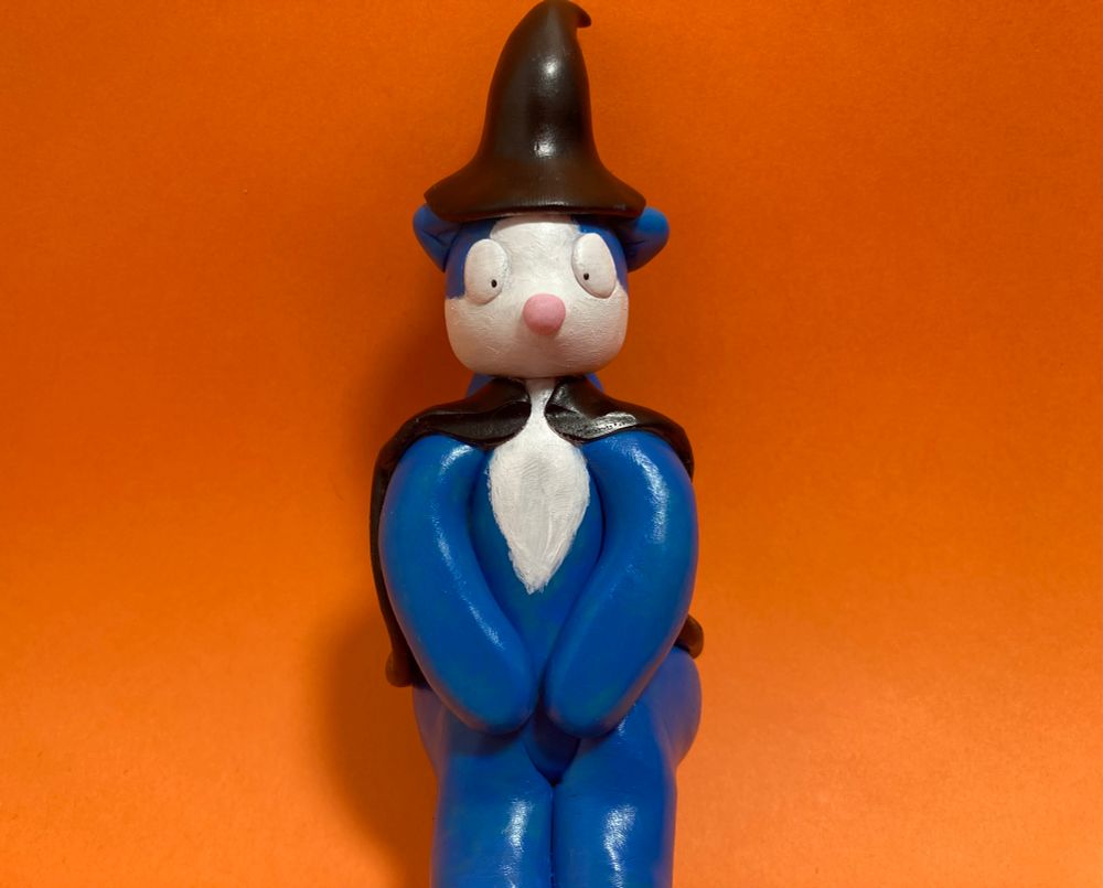 Spike, the skunk boy on an orange background 