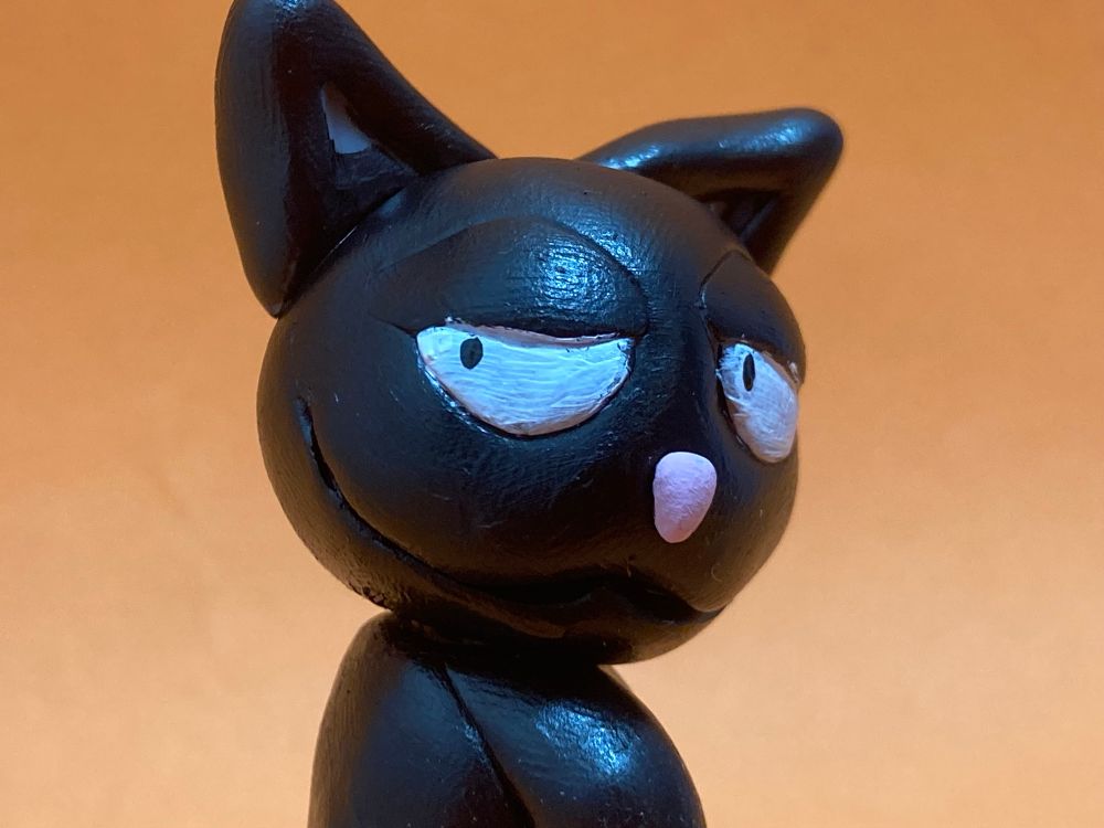 Halloween cat boy smiling over his shoulder 