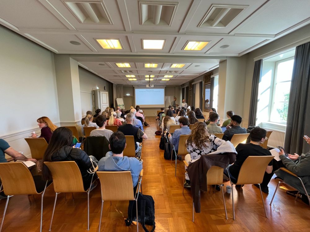 The participants watch one of the talks during the symposium.