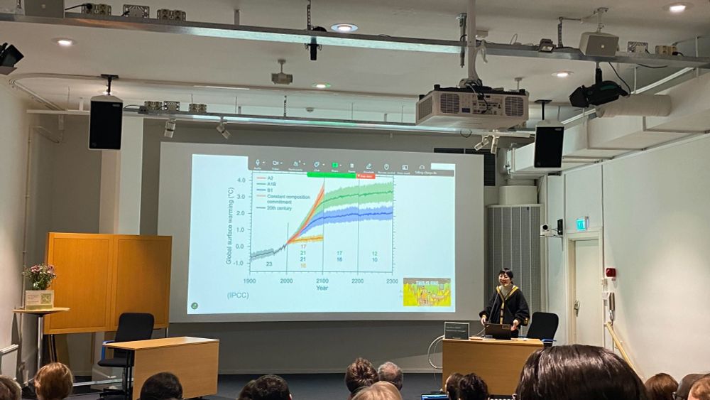 A photo of Chenyu Jin presenting her research during the half-time PhD seminar.