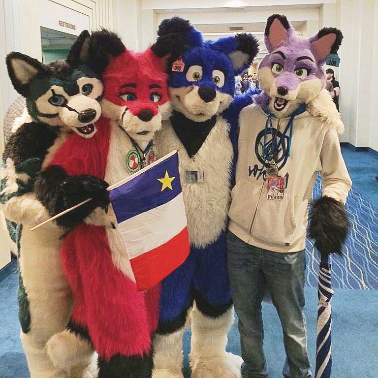 Glacier Dolby Nev and Colbey pose in a hotel hallway