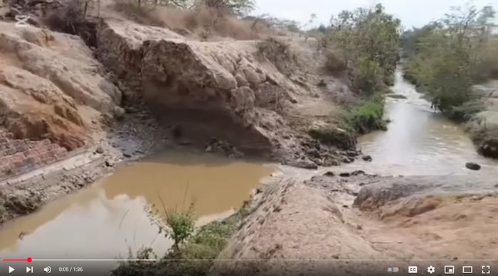 Photo taken in the field showing what looks like an irrigation canal offset right-laterally by several meters