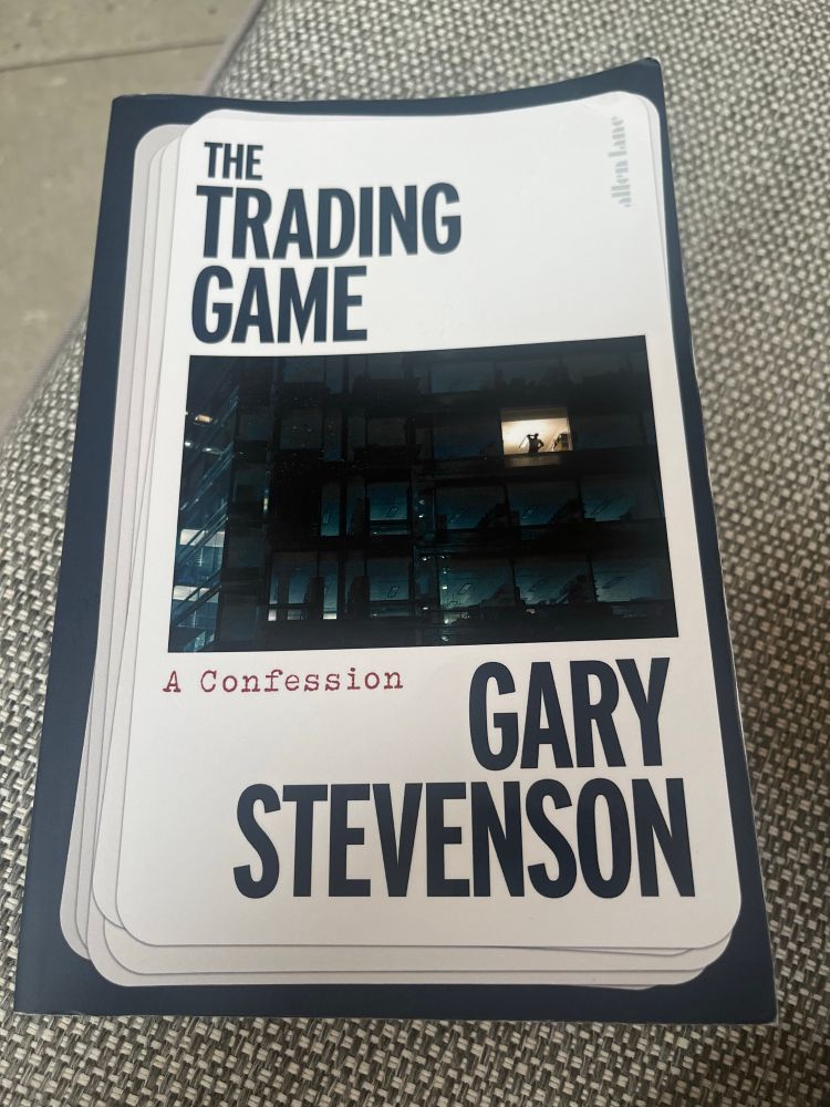 Book cover with a photo of a silhouette of a man in one lit window of a high rise building. 