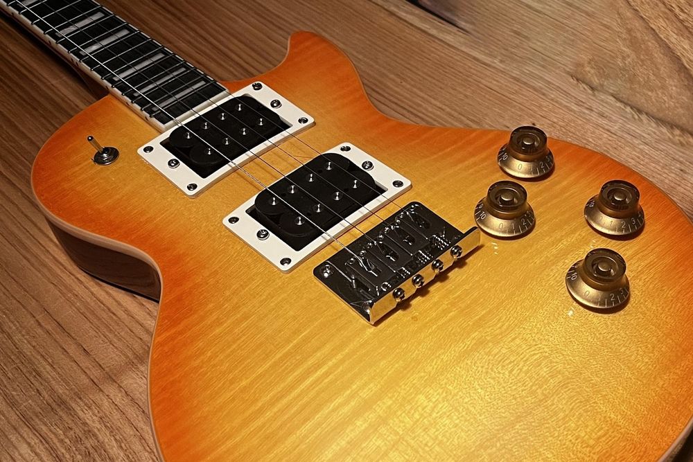 A photo of an electric ukulele.