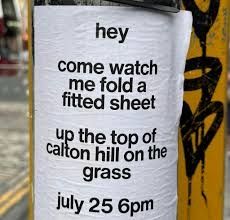 Poster that says "hey come watch me fold a fitted sheet" on Calton Hill