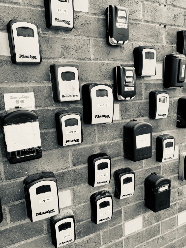 A wall filled with spare house key security boxes 
