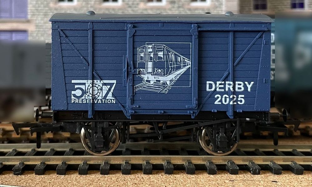 OO Scale wagon in blue with grey roof, with Class 507 Preservation logo, picture of Class 507, and "DERBY 2025" text.