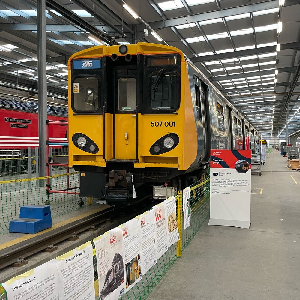 507001 in the shed at Alstom Derby, with added interpretation panels and information displays in view