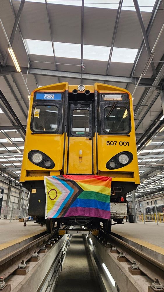 Class 507 cab with progress pride flag hanging from it