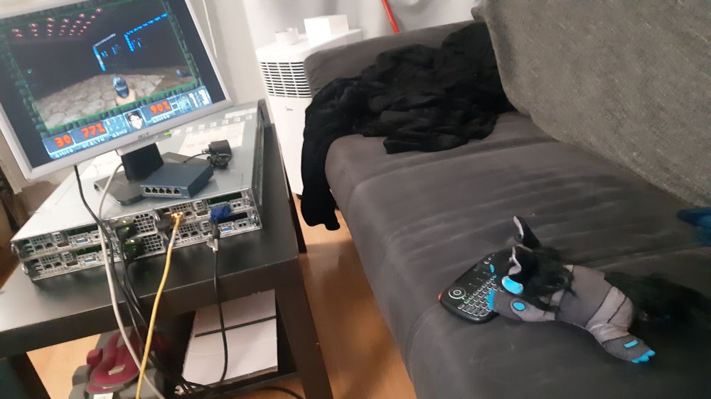 A protogen playing doom from the couch