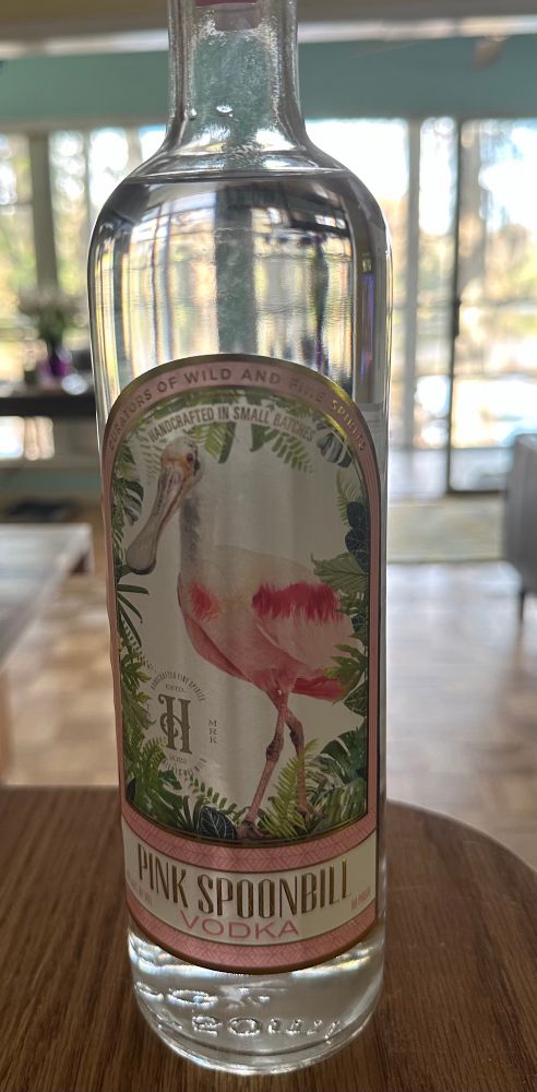 Bottle of vodka with a pink roseate spoonbill depicted on the label. 