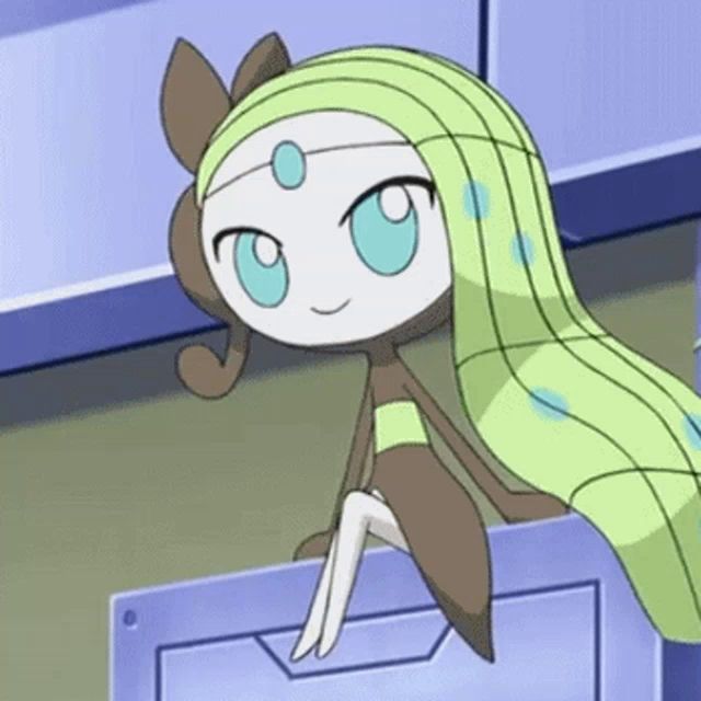 a cartoon character with long green hair and blue eyes is sitting on a blue box .