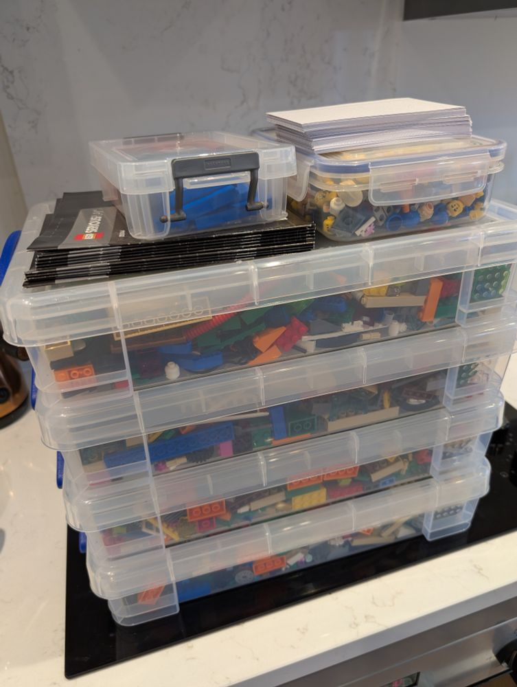 Lots of boxes full of Lego bricks 