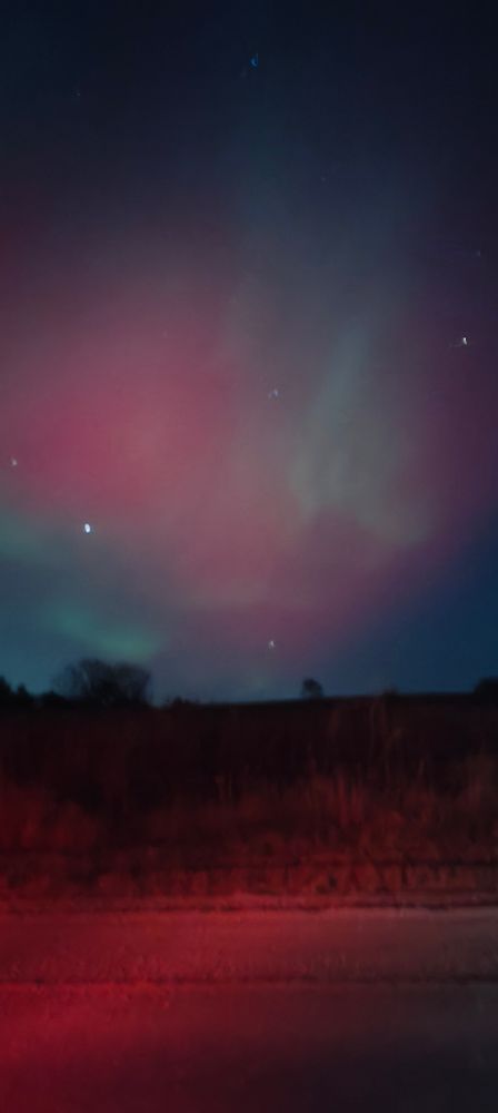 Red and green aurora borealis in the sky