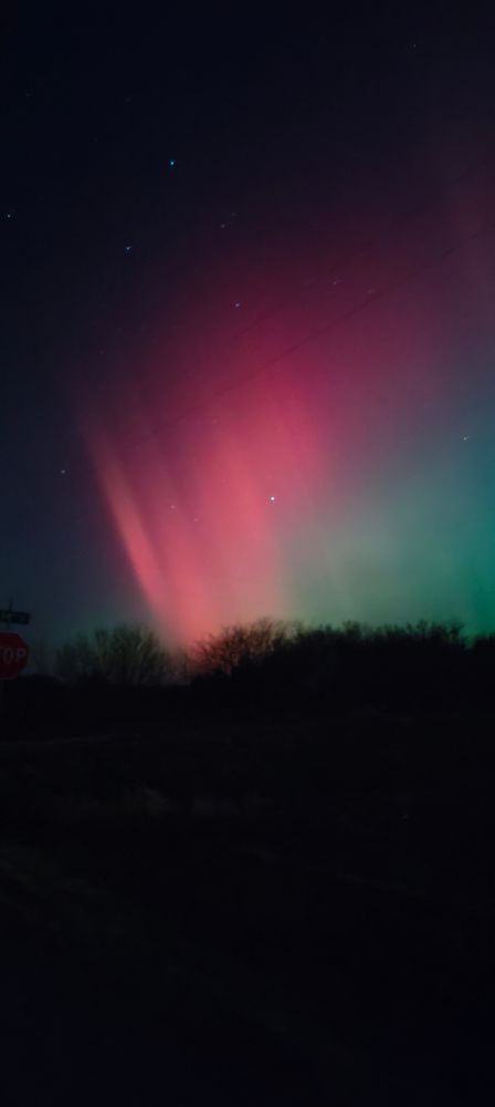 Red and green aurora borealis in the sky