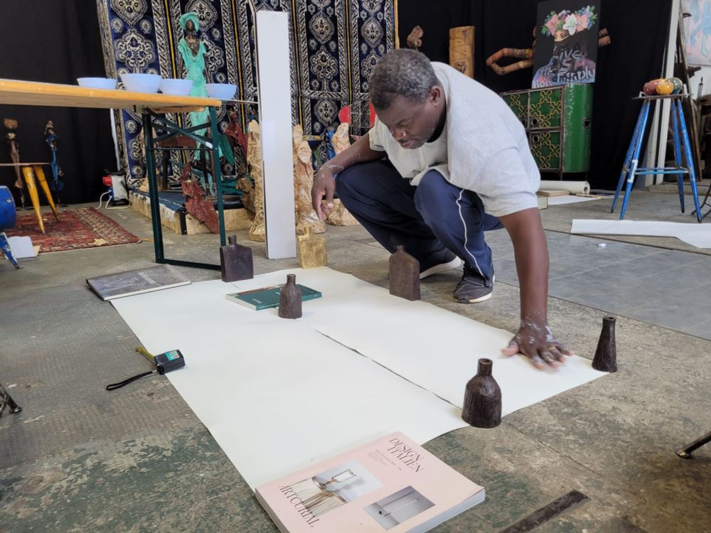 Sawadogo preparing for painting in the creative hall of Moogoo