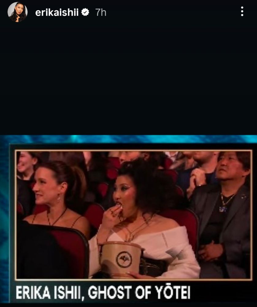 Erika Ishii eating popcorn from the Ghost of Yōtei popcorn bucket. 