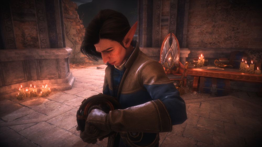 Antoine from Dragon Age the Veilguard, looking down and working on an orb mechanism. He wears brown gloves and a blue and light brown outfit.
