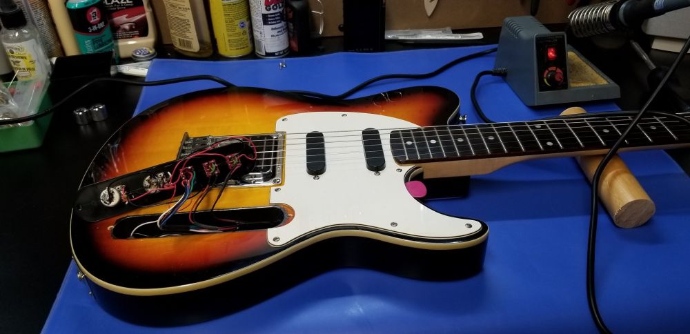 Here's a Humbucker-Single-Single base, a Peavey Generation EXP (telecaster interpretation), with two stacked Humbuckers in the single slots. The stacked humbuckers are wired phase-switchable by way of two mini double-pole double-throw on-off-on switches in a modified control plate (in this image) with the standard Humbucker wired series/parallel via a double-pole double-throw mini on-off-on toggle switch.