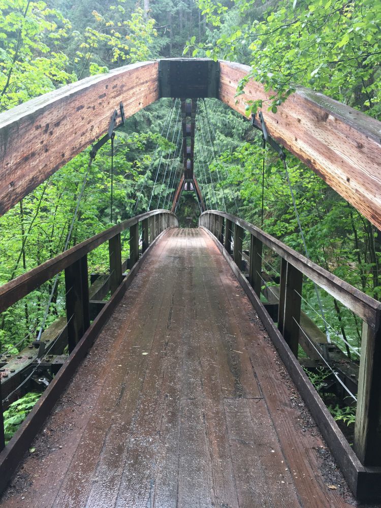 A large wooden suspension footbridge. 