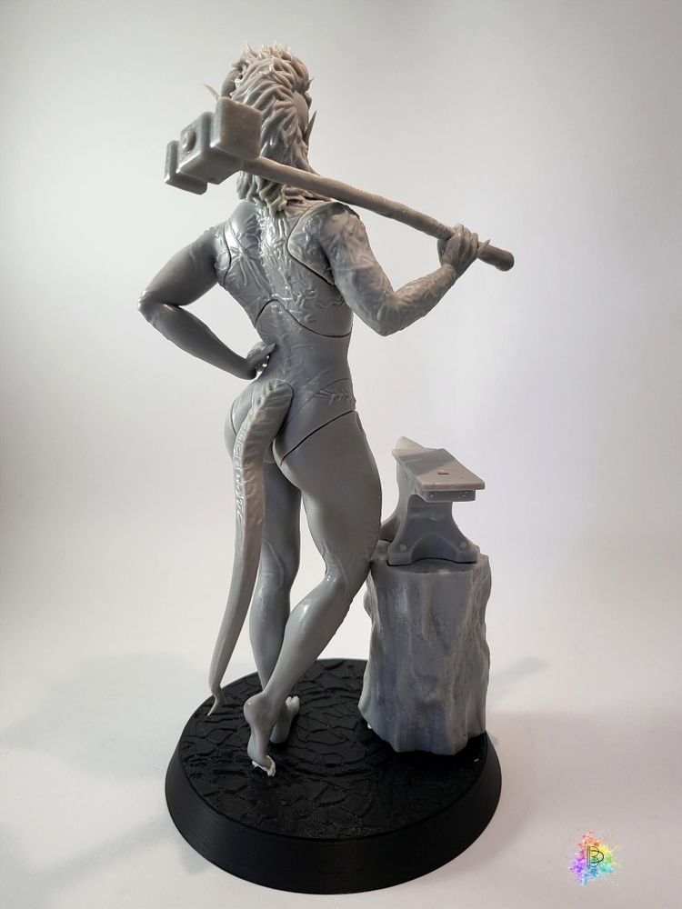 The same printed figure, viewed from the back