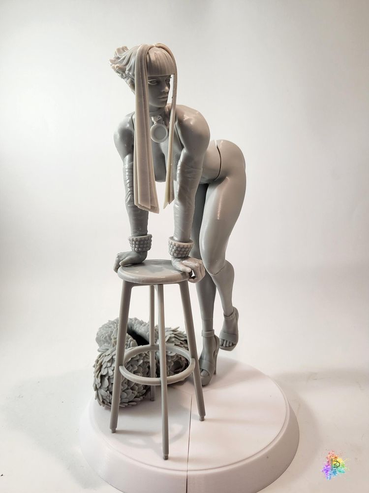 A test-print of the figure, in grey resin