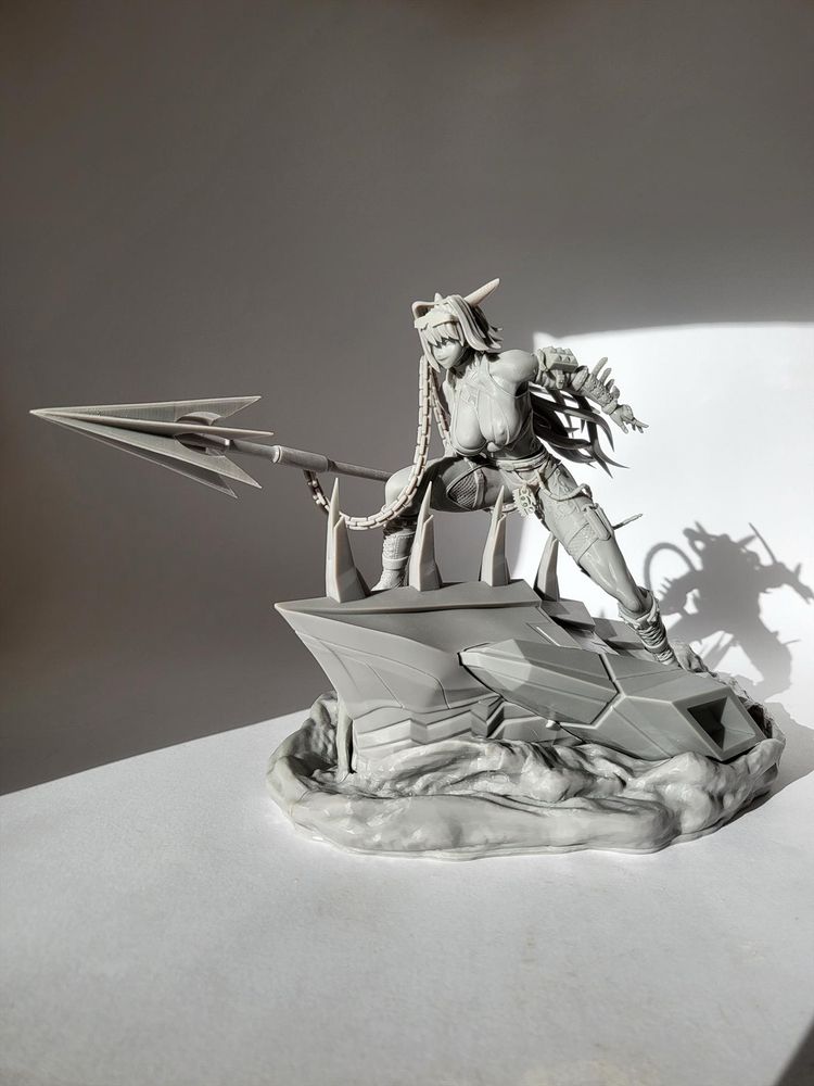 A test-print of the figure, in grey resin.