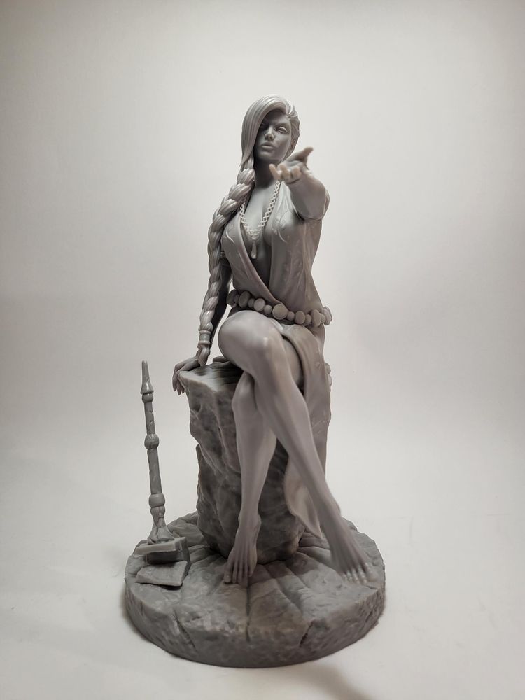 A test-print of the figure, in grey resin.