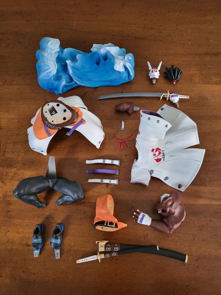 The same painted figure, but disassembled in all its parts.