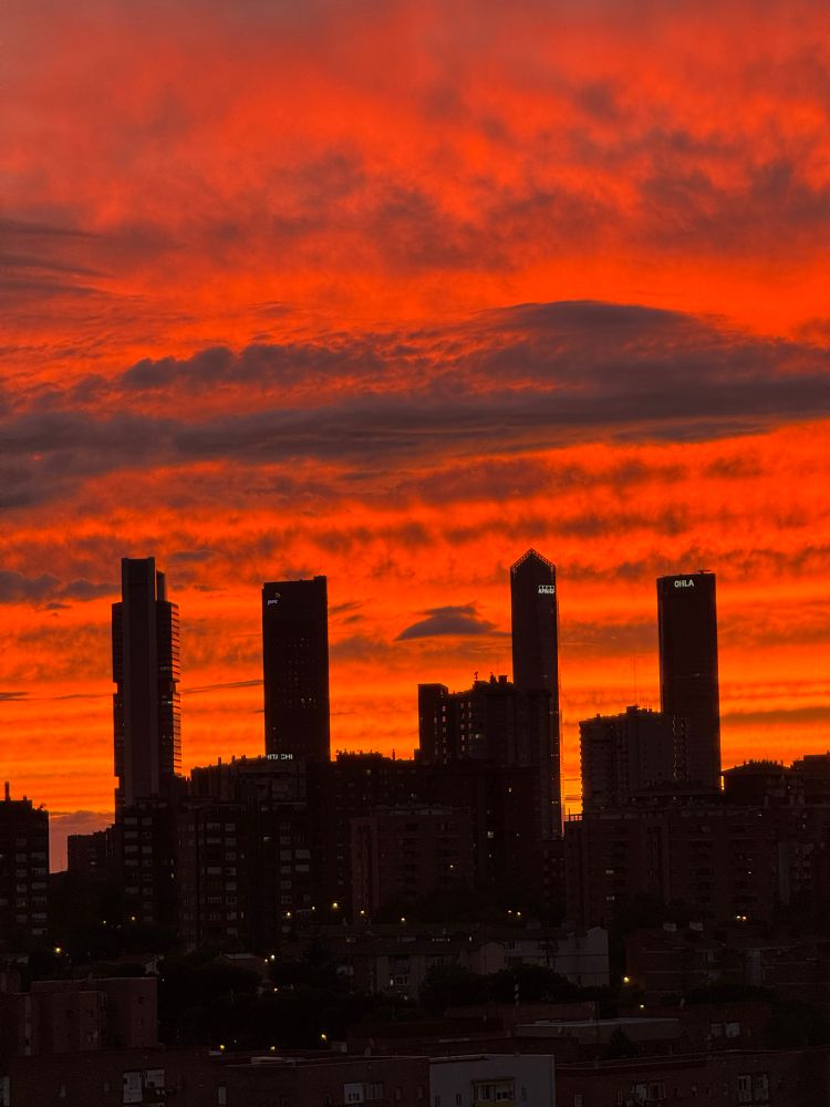 Sunset behind the four towers of the Cuatro Torres business district, Madrid. 