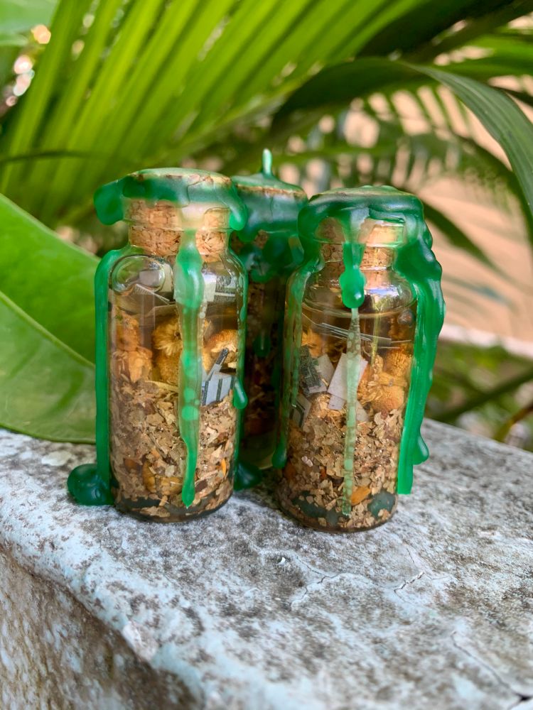 3 mini “sweetening” spell jars with herbs, honey & money in them. Sealed with green wax 