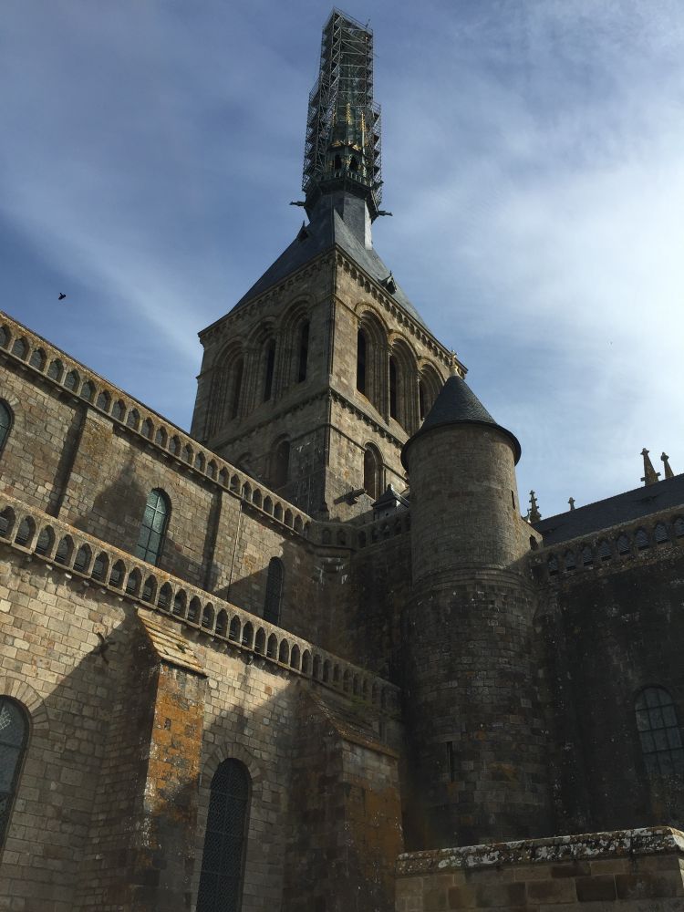 Old stone buildings and tower part of Mont-St-Michel in France