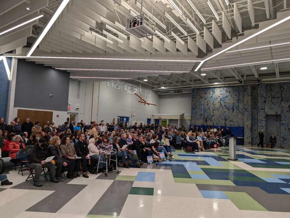 Caruso middle school cafeteria filled with people