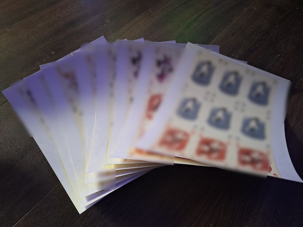 A bunch of printed cardstock, but it's all curvy and warpy.

Card identities have been blurred to protect the innocent.