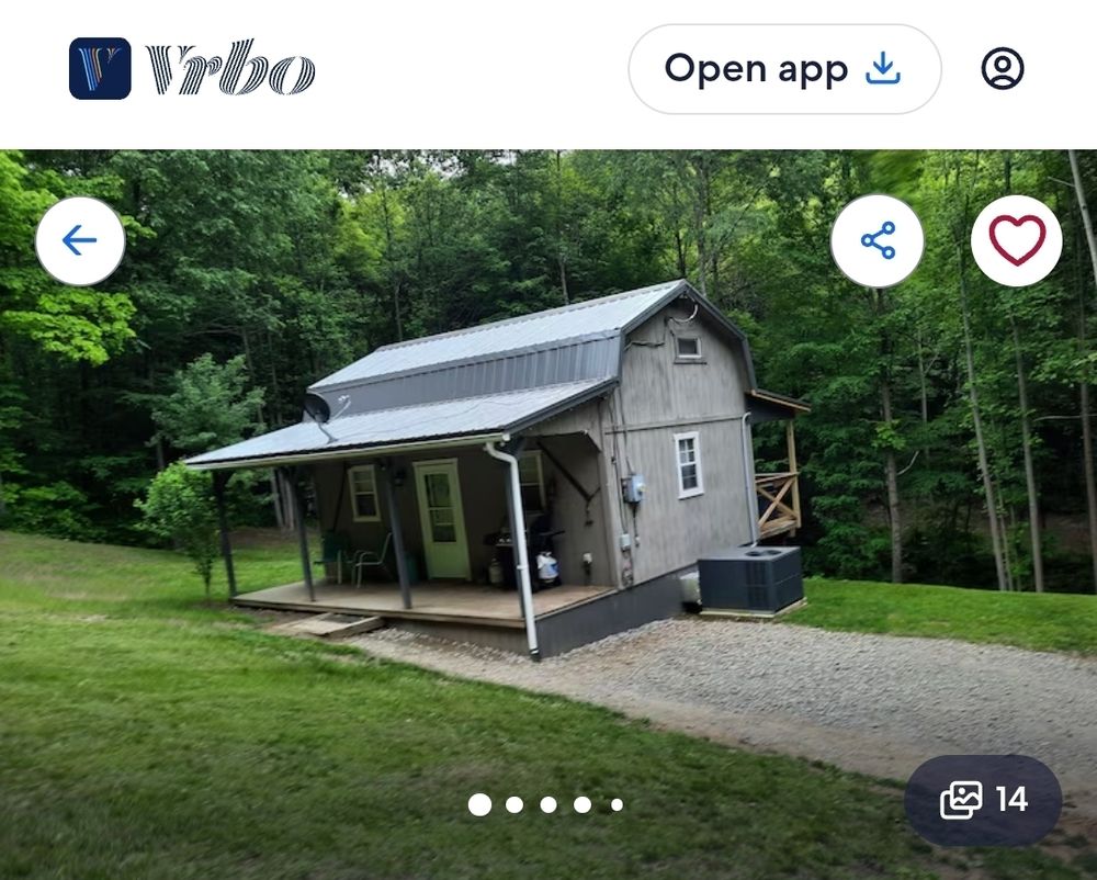 Screenshot from a VRBO listing of a small cabin that appears to be lopsided