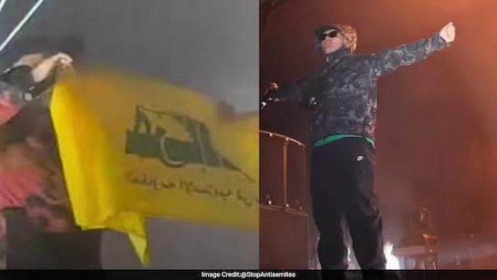 Mo Chara of Kneecap with a Hezbollah flag from a gig in 2024.