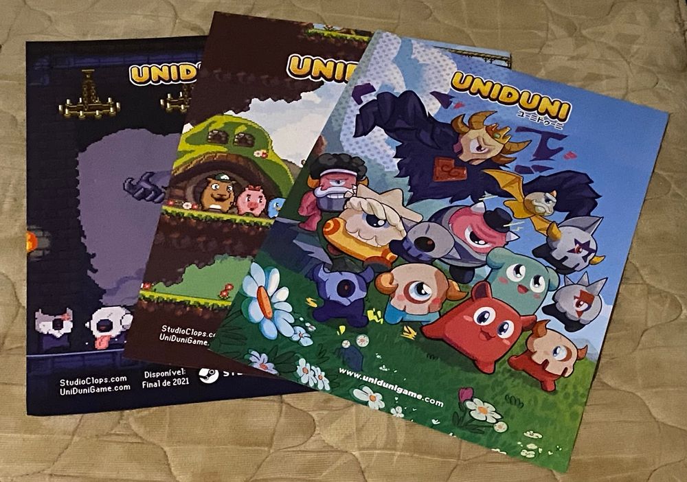 the three posters for the game Uniduni, featuring the artwork of the little monsters of the game or some screenshots. 