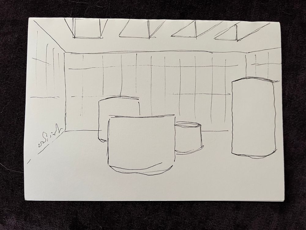 A drawing of four large cylindrical of various heights in the middle of a room with skylights. Sculpture by Richard Serra.