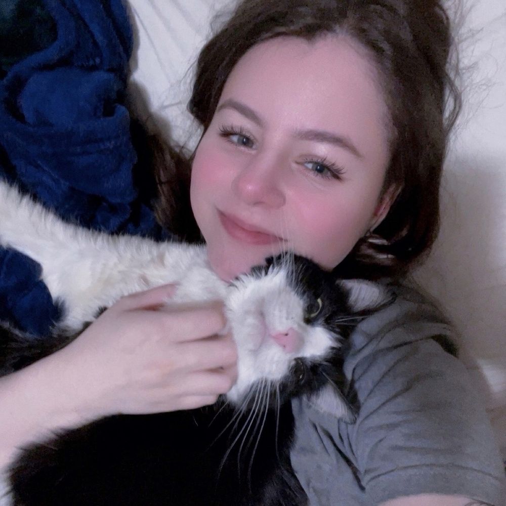 A selfie of me holding my cat Jack 