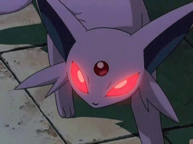 a purple pokemon with red eyes is walking on the ground .